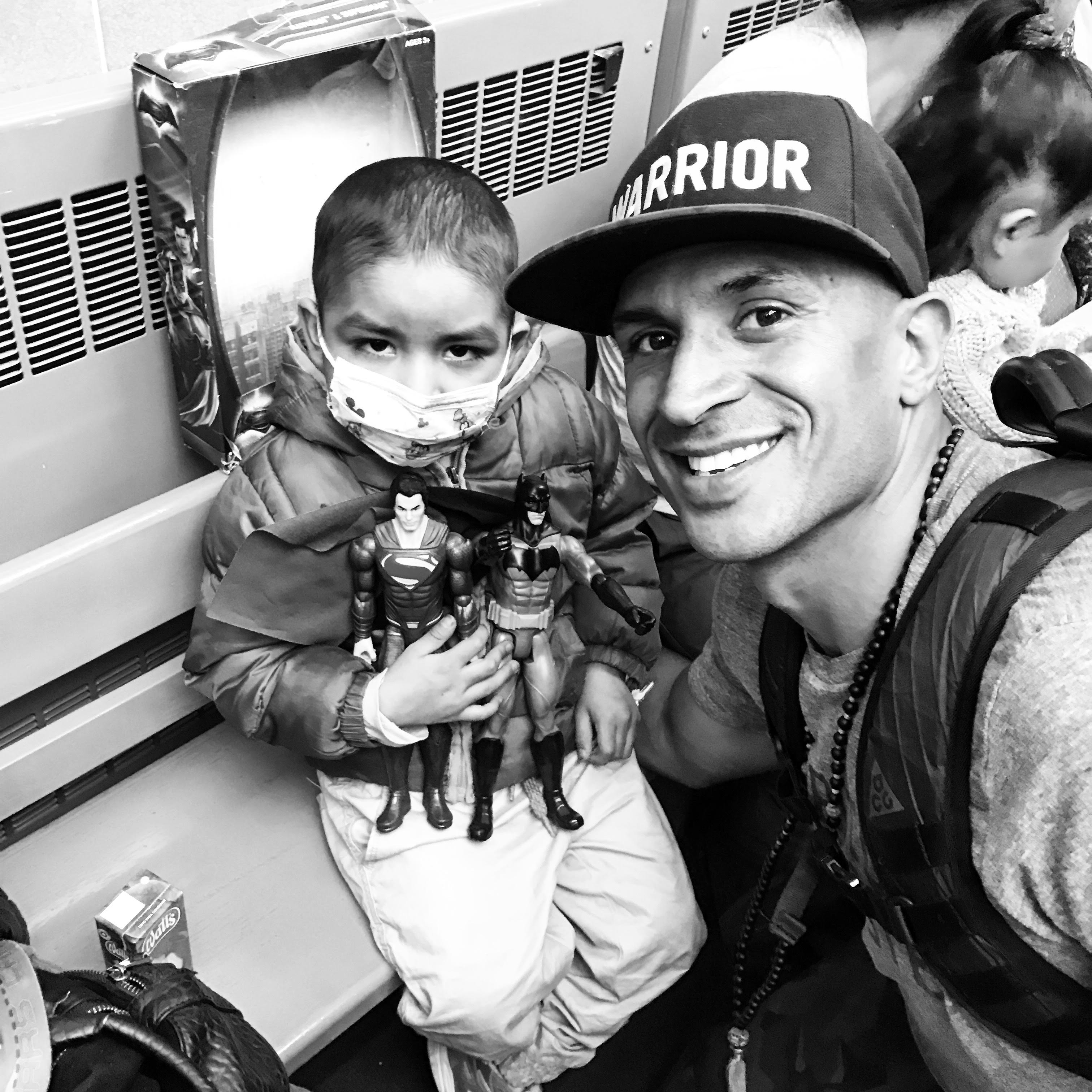 Branden Collinsworth and sick child in Peru.
