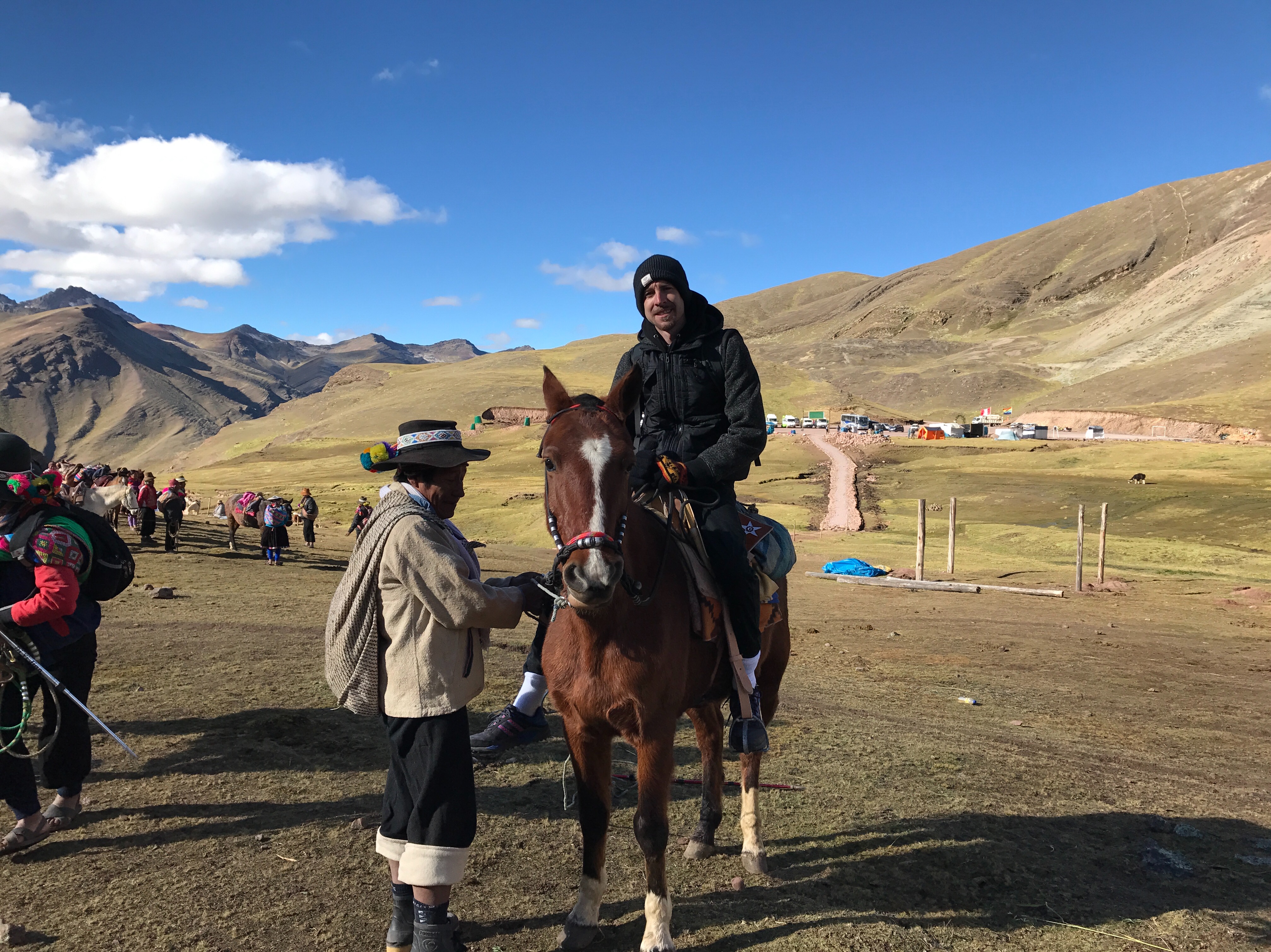 Anthony Alegrete riding a horse on Rainbow Mountain